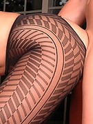 MILF in sexy patterned black pantyhose and red high heels getting banged