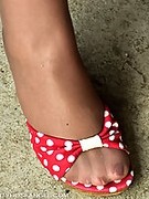 Mature exposes public in shiny and suntan pantyhose