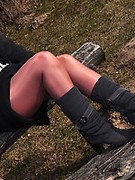 Angel in Boots and Shiny Pantyhose outside