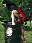 Sexy lady in stockings over pantyhose and red stiletto heels