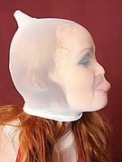 Redhead babe mastrubates covered in pantyhose layers