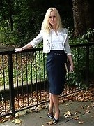 Blonde Milf teasing outdoors in a lovely pair of blue high heels and nylons
