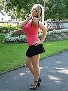 This slender blonde looks amazing in high heels nude pantyhose and short skirt